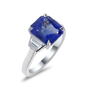 Three stone octagonal sapphire with trapezoid diamond ring
