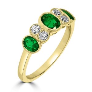 Seven stone all oval emerald and diamond ring